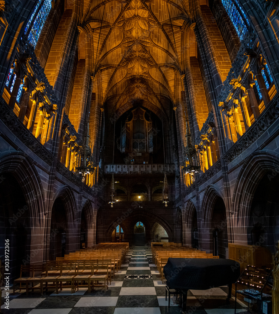 LIVERPOOL, ENGLAND, DECEMBER 27, 2018: The Lady Chapel in Liverpool Anglican Cathedral. Panoramic view of a magnificent part inside the church, where light meets darkness all along place.