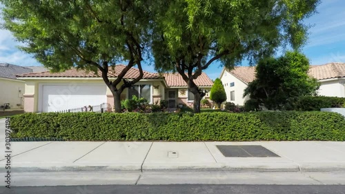 Driving through an American southwestern suburban neighborhood on a sunny day