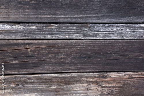 Dark weathered wood texture background surface with old natural pattern. Rough, uneven. Copy space. Top view.