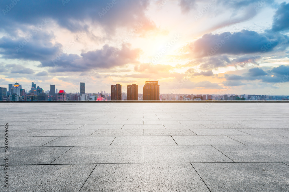 Empty square floor and modern cityscape in Shanghai at sunset. Empty square floor and modern cityscape in Shanghai at sunset.