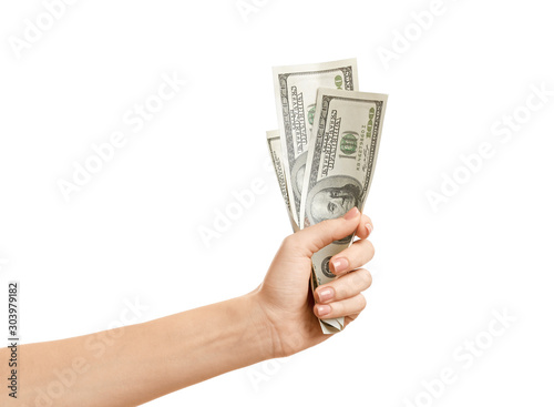 Female hand with dollar banknotes on white background