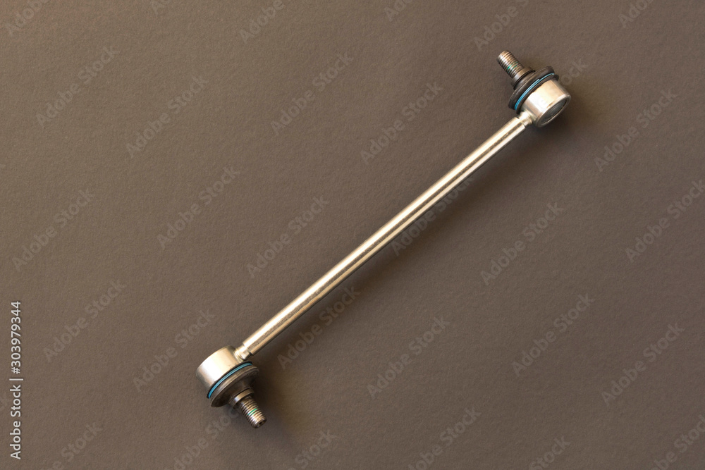 New car parts. Stabilizer link. Isolated on black background.