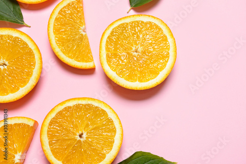 Fresh orange slices on color background