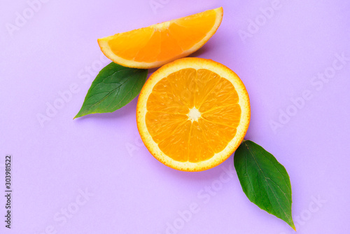 Fresh orange pieces on color background