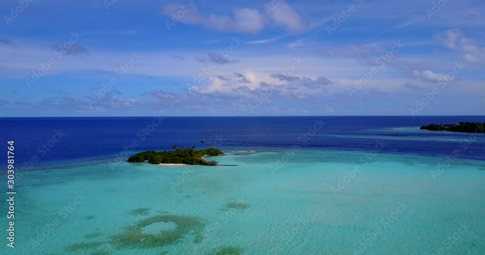 Idyllic vacation location with remote tiny islands of tropic with lush vegetation surrounded by turquoise lagoon with coral reef in Maldives Idyllic vacation location with remote tiny islands of tropic with lush vegetation surrounded by turquoise lagoon with coral reef in Maldives