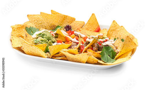 Plate with tasty chili con carne, guacamole and nachos on white background photo