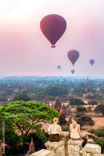 Western tourists Happily watching the balloon In the pagoda area of Bagan, Myanmar