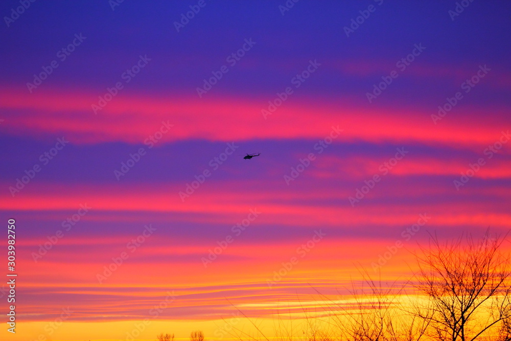 sunset with helicopter
