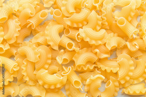 Heap of uncooked pasta, closeup