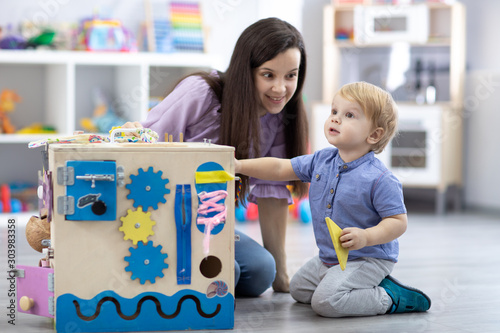 Cute toddler baby and his m...