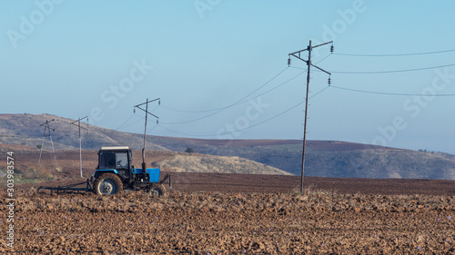 Tractor plows a farm field