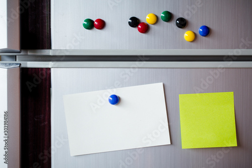Abstract Empty paper sheet with magnet on refrigerator door. paper note background.