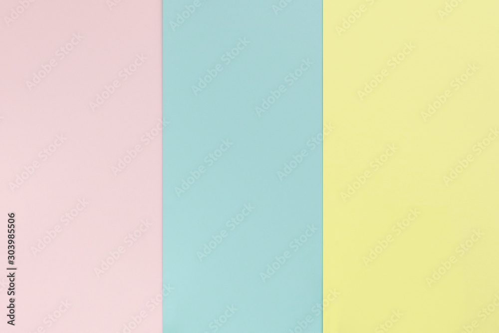 Yelllow pink blue color paper background. Geometric flat composition. Empty space on monochrome cardboard Yelllow pink blue color paper background. Geometric flat composition. Empty space on monochrome cardboard
