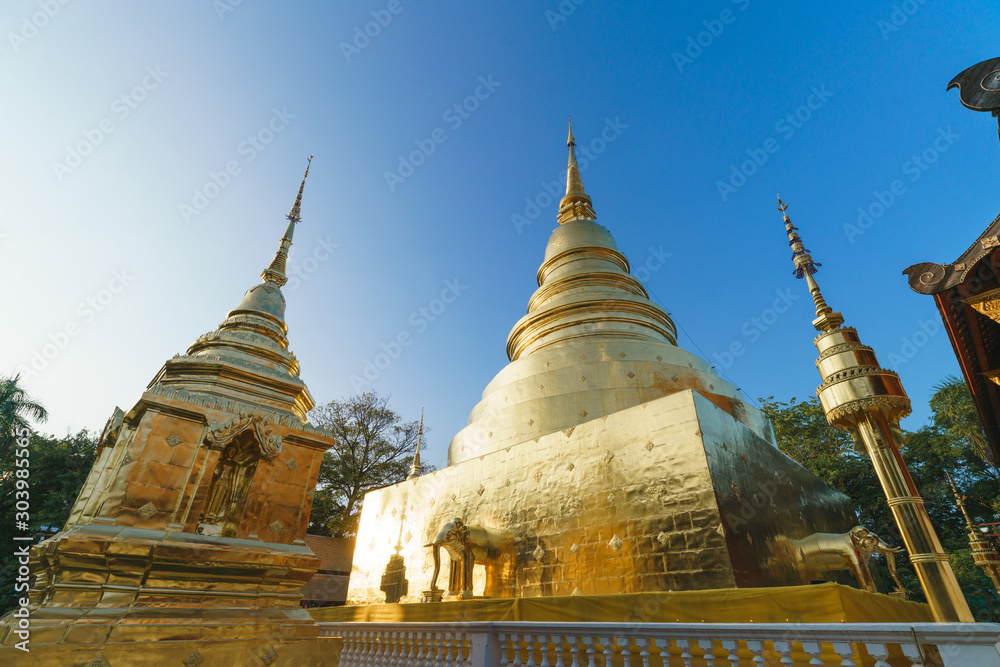 Naklejka premium Lanna style Thailand temple, Wat Phra Singh with big golden pagoda in Chiang Mai, Thailand