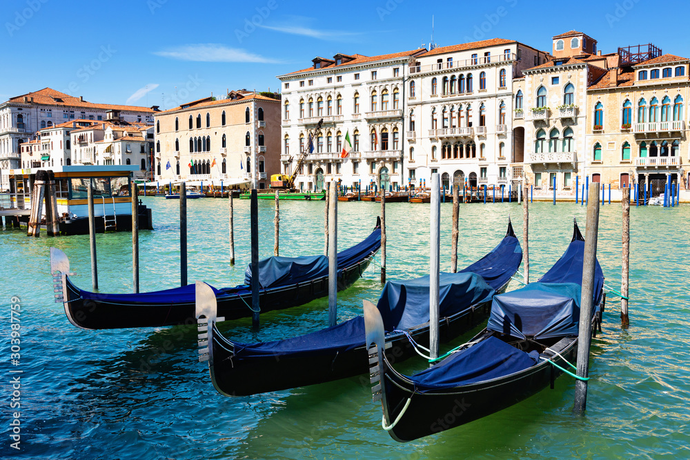 Venetian gondolas moored in Grand Canal