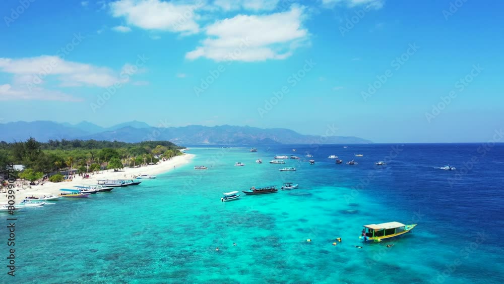Moored boats in the beautiful blue lagoon of Philippines tropical island