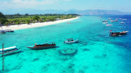 Beautiful beach. View of a nice tropical beach with boats and turquoise water in Gili Nanggu. Holiday and vacation concept. photo