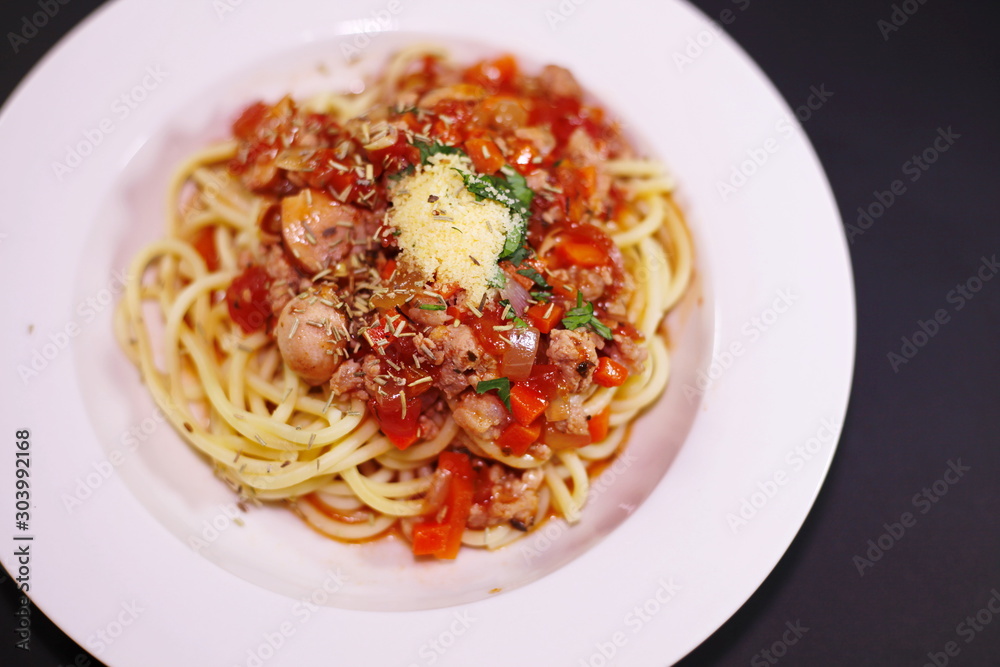 Spaghetti on a plate on a black background Spaghetti on a plate on a black background
