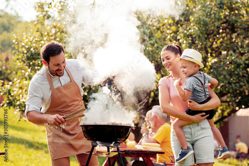 Family making  barbecue together