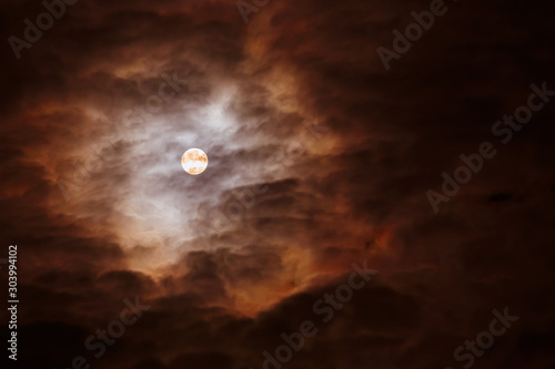 Full moon dark cloudy sky.horizontal frame.