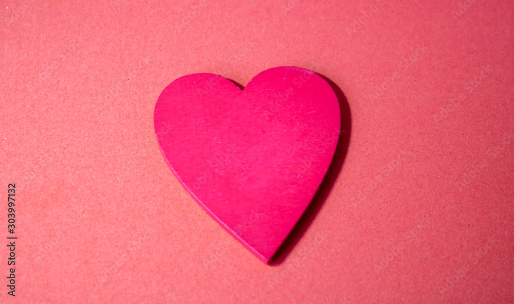 Red heart with letter words of give isolated on pink background. Giving, sharing, charities and donate concept