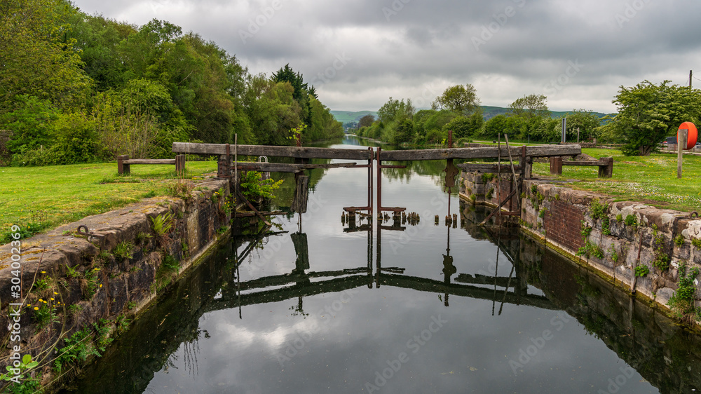 Obraz premium The closed gates of the sluice leading into the Ulverston Canal in Canal Foot, Cumbria, England, UK