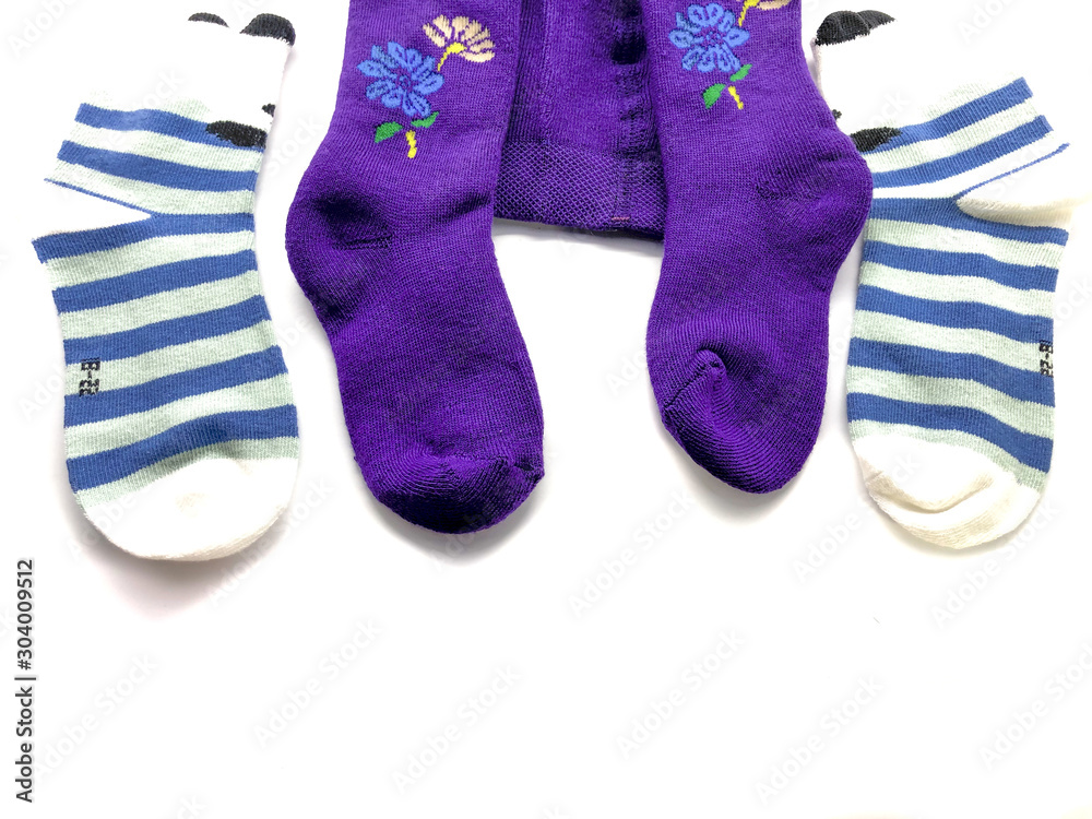 Set of socks isolated on a white background. Composition of multi-colored socks. Children's socks. Socks background. Set of socks isolated on a white background. Composition of multi-colored socks. Children's socks. Socks background.