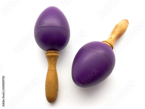 Purple baby rattles isolated on white background. Toy from a tree for children. Musical toy for small children. Maracas