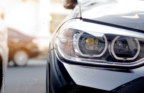 The front lights of the sports car. © nawin