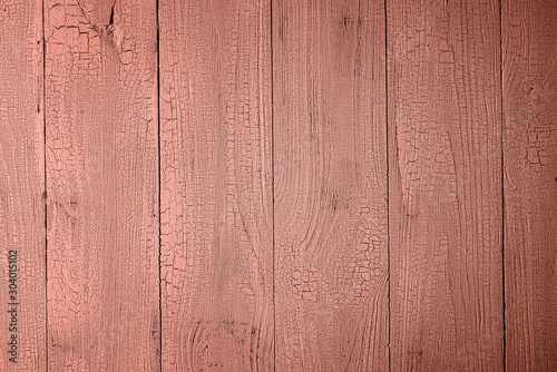 Aged coral pink painted wooden background