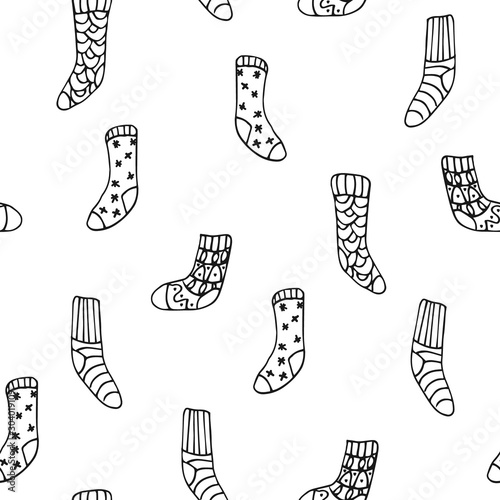 Vector seamless pattern with cute hygge socks on white background. Great print  for fabric, wrapping papers, wallpapers, fabric, cover. Doodle style illustration in black ink, outline.