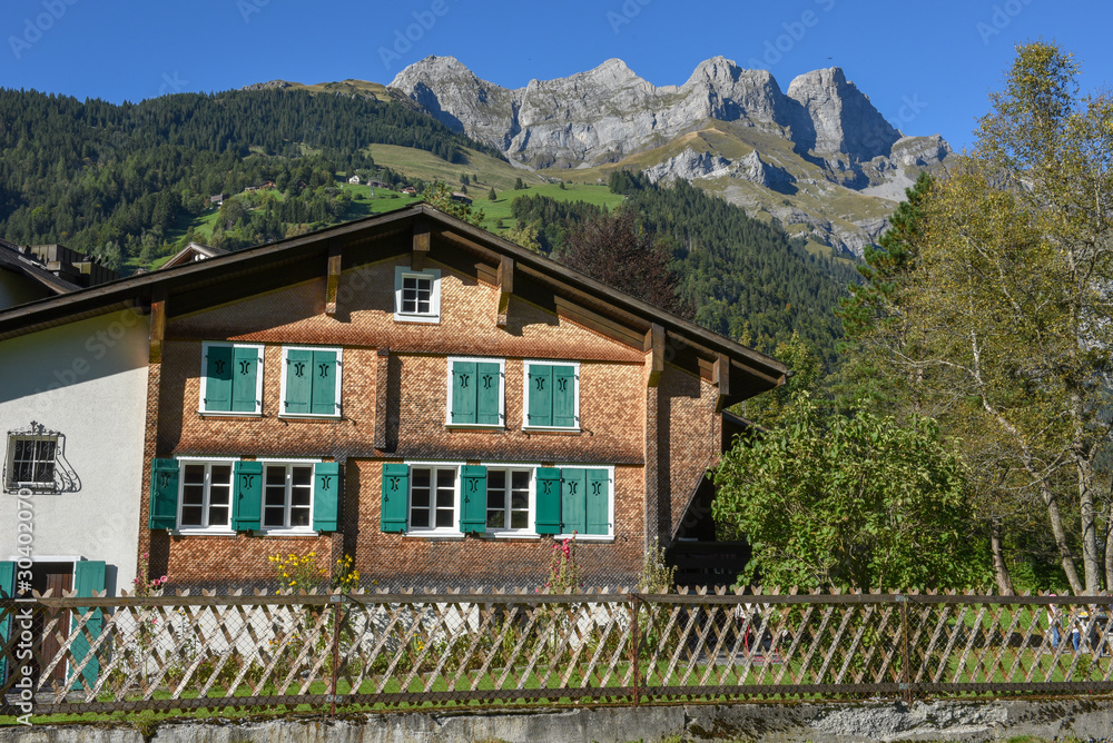 Rural landscape with traditional chalet at Engelberg in the Swiss alps Rural landscape with traditional chalet at Engelberg in the Swiss alps