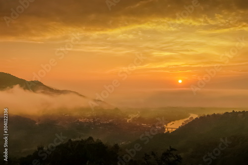 Mountain view misty morning above Kok river and Tha Ton city in valley around with sea of mist with cloudy sky background  sunrise at Wat Tha Ton  Fang  Chiang Mai  northern of Thailand.
