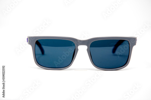 blue and gray sunglasses isolated over the white background