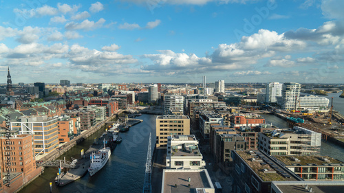 hafencity hamburg cityscape with many boats  modern houses and clouds  germany
