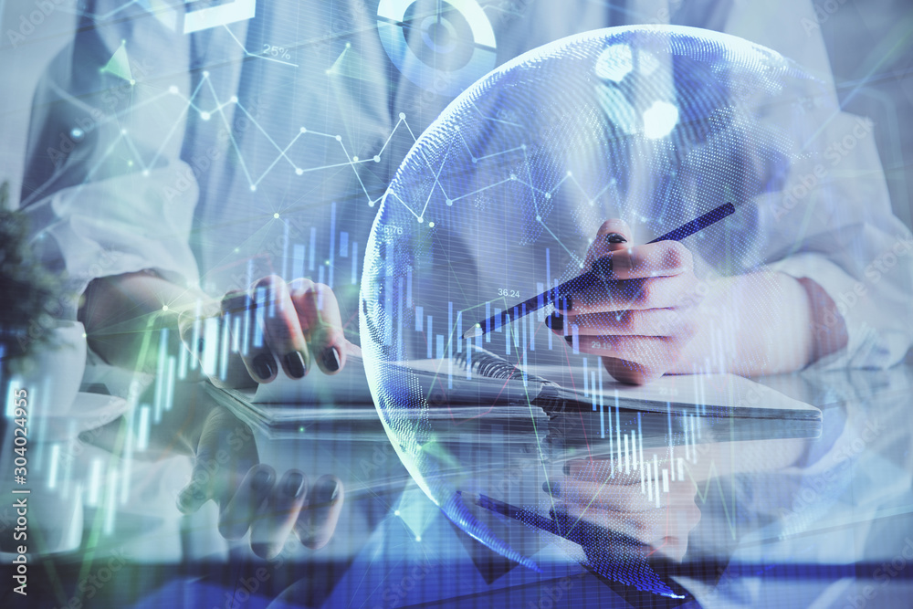 Financial forex graph drawn over hands taking notes background. Concept of research. Double exposure Financial forex graph drawn over hands taking notes background. Concept of research. Double exposure
