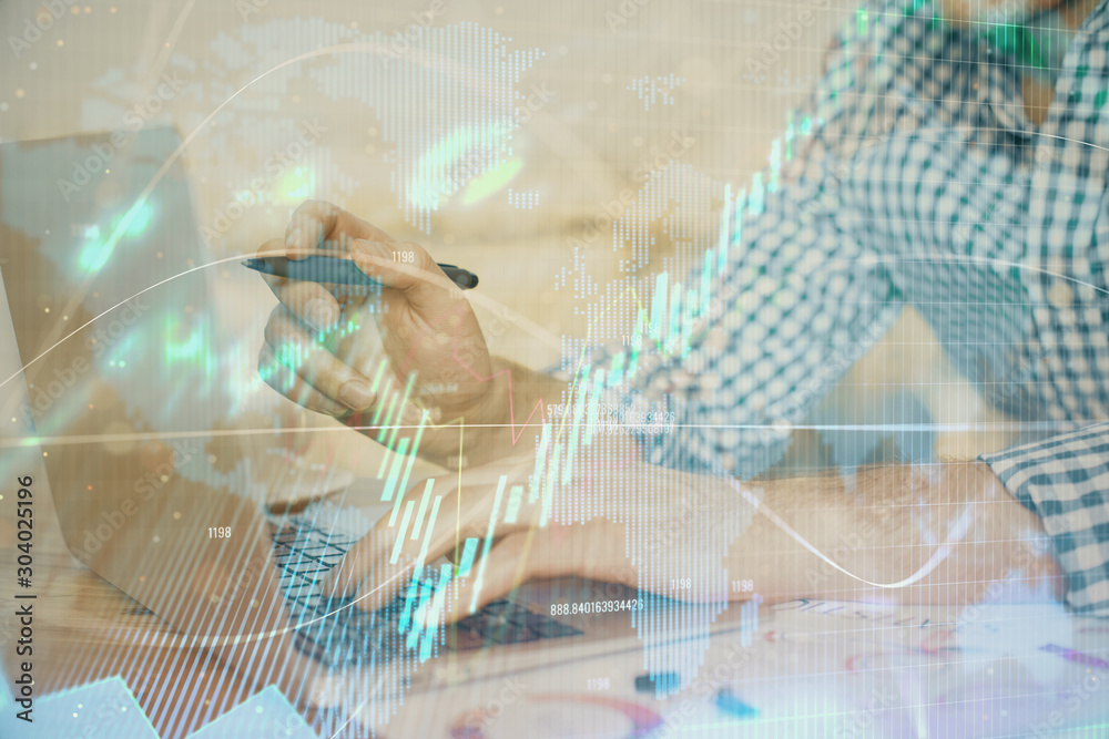 Multi exposure of forex graph with man working on computer on background. Concept of market analysis. Multi exposure of forex graph with man working on computer on background. Concept of market analysis.