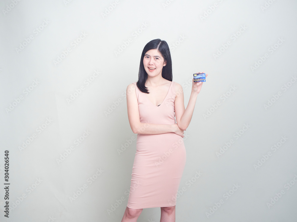 Portrait of young woman showing credit card Portrait of young woman showing credit card