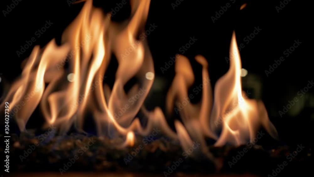 Fire On Burning Coals In The Dark During The Night - Flames - Elemental - Close Up Shot Fire On Burning Coals In The Dark During The Night - Flames - Elemental - Close Up Shot
