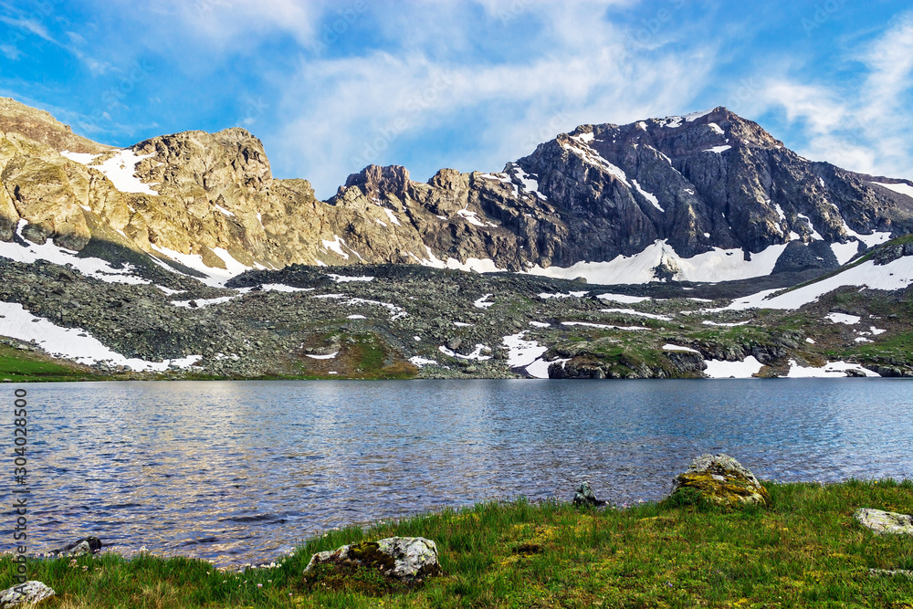 large cold lake high in the caucasus mountains