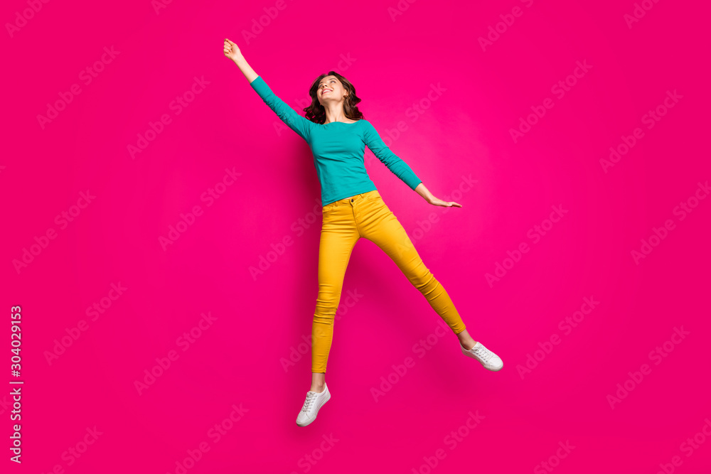 Full length body size photo of cheerful nice pretty cute sweet girlfriend wearing white sneakers holding parasol with wind blowing her away isolated fuchsia vivid color background