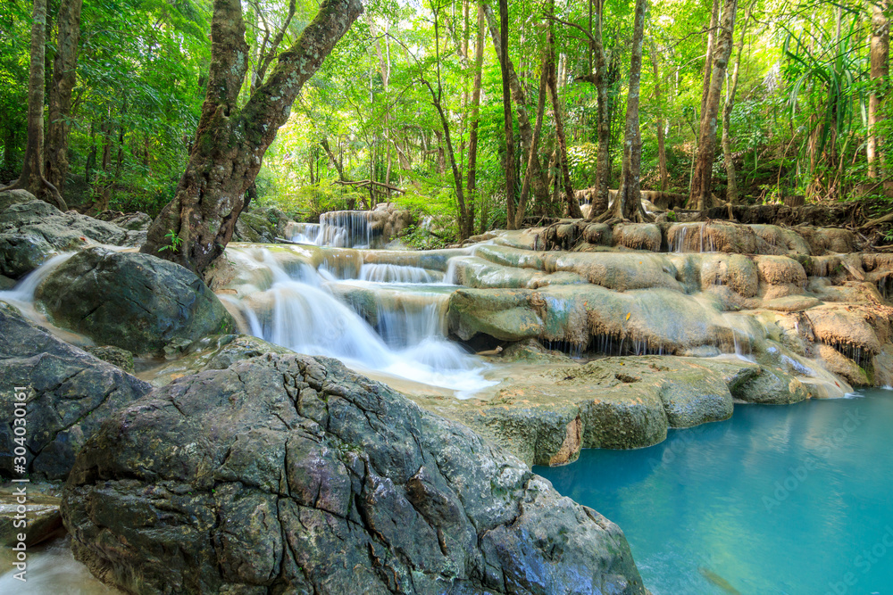Naklejka premium Waterfalls In Deep Forest at Erawan Waterfall in National Park Kanchanaburi Thailand