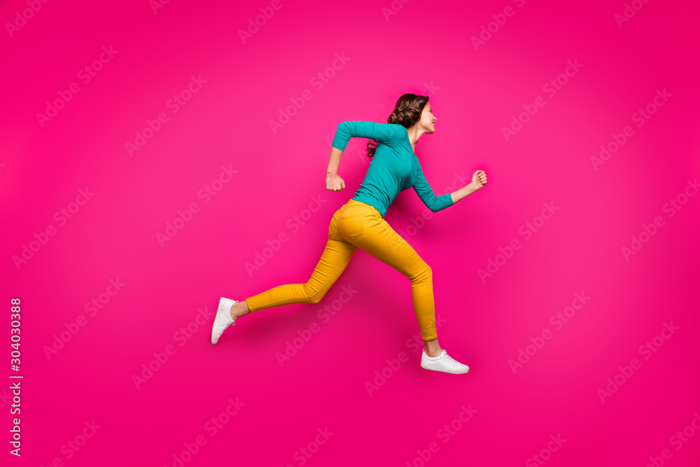 Full length body size photo of pretty cute nice sweet girl running towards shopping senter in footwear yellow pants isolated vivid color pink background
