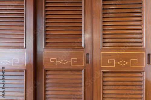Wood door of an armoire background © Sen