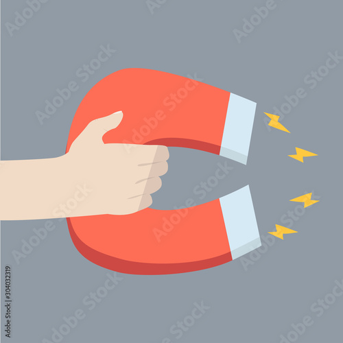 Hand holding large magnet vector
