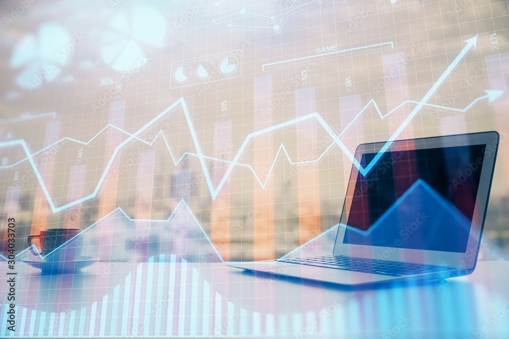 Stock market graph and table with computer background. Double exposure. Concept of financial analysis. Stock market graph and table with computer background. Double exposure. Concept of financial analysis.