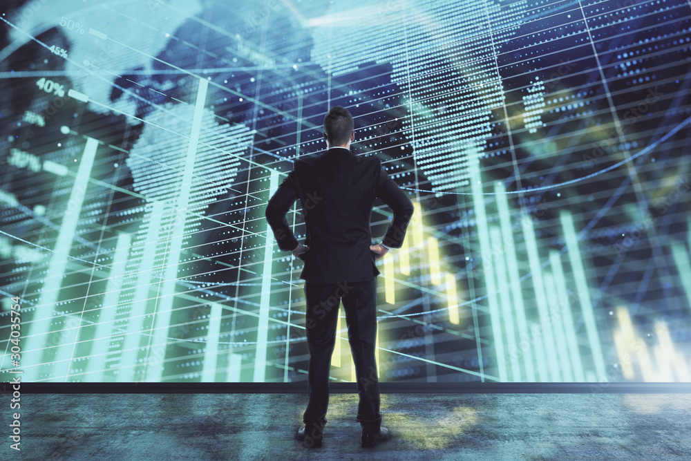 Businessman and forex graph and world map hologram. Double exposure. Concept of financial education and analysis Businessman and forex graph and world map hologram. Double exposure. Concept of financial education and analysis
