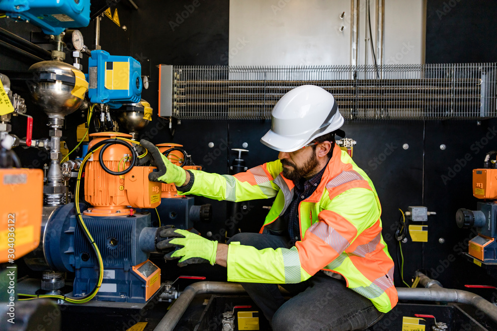 Engineer checking measuring devices Engineer checking measuring devices