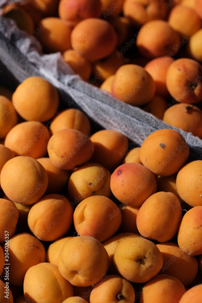 apricots on the counter of a farmers market. Natural Organic Fruits.