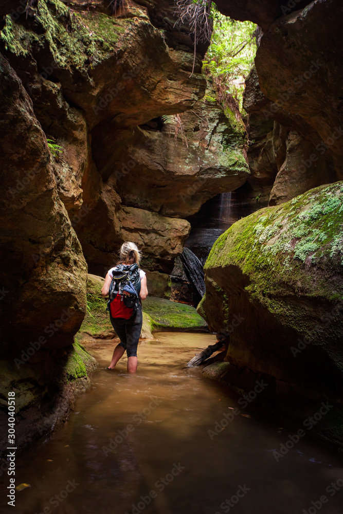 Tourist or female adventurer exploring a canyon